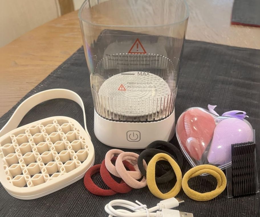 electric makeup brush cleaner shown with included accessories
