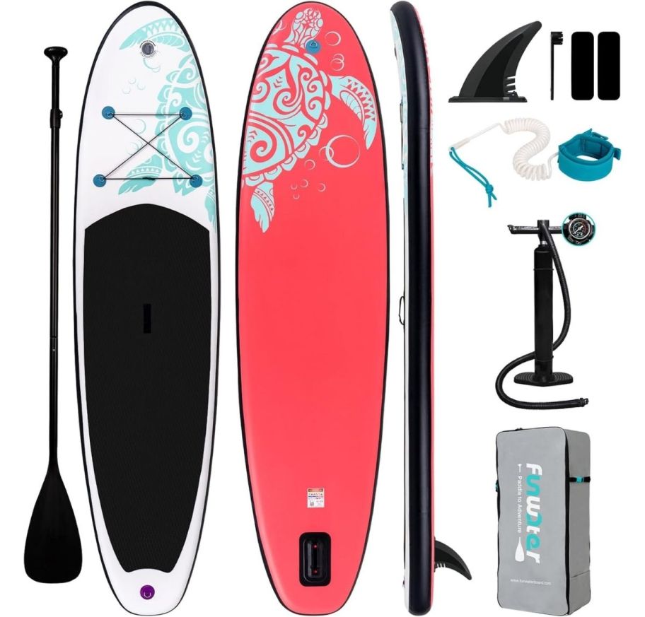 a coral pink and white paddle board shown with accessories including air pump, fins, paddle and ankle tether