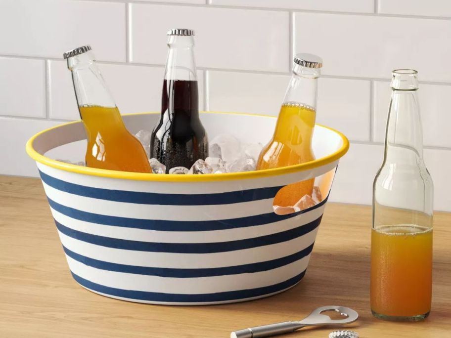 striped Room Essentials Metal Beverage Tub on counter with bottles and ice in it