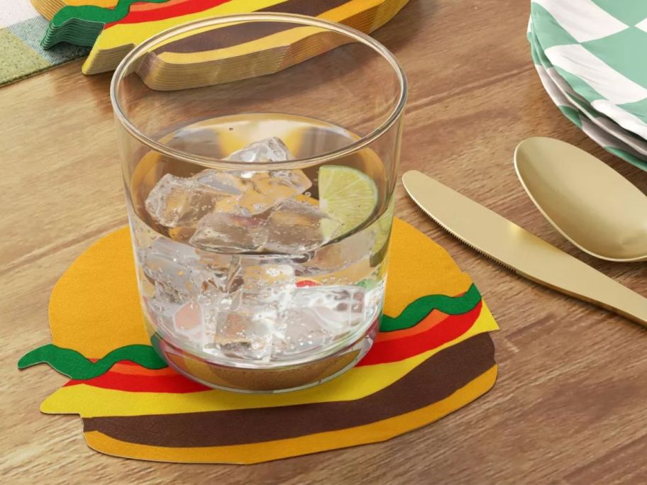 Room Essentials Hamburger Figural Napkin underneath drink on table