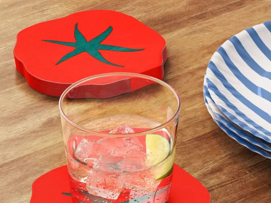 a stack of Room Essentials Tomatoes Figural Napkins on table