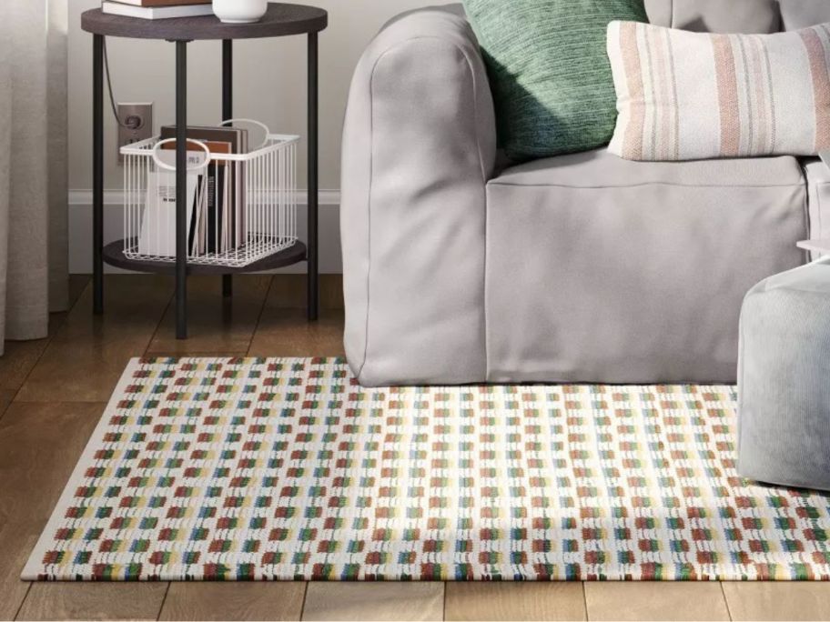 multicolored Handwoven Area Rug on floor in living room