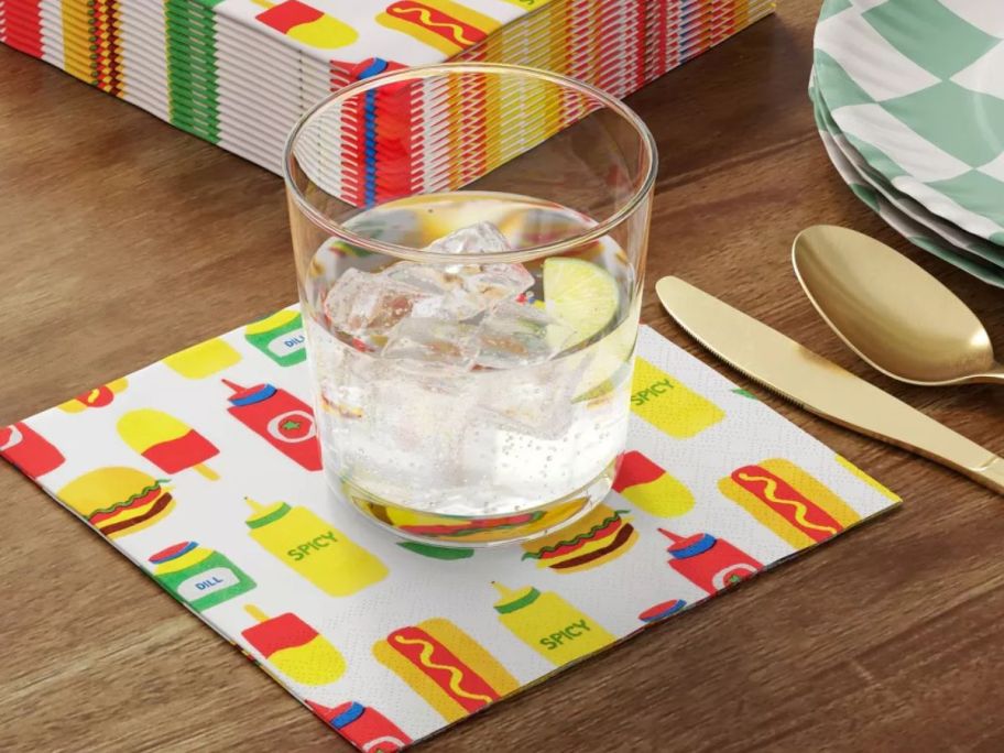 Room Essentials Condiment Print Square Napkin underneath a drink on table