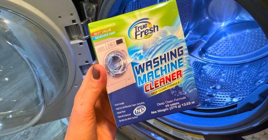 hand holding a box of True Fresh Washing Machine Cleaner Tablets
