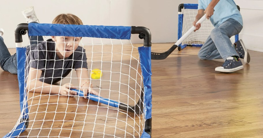 two kids playing inside with the Franklin Sports 3-in-1 Indoor Mini Kids Sports Set