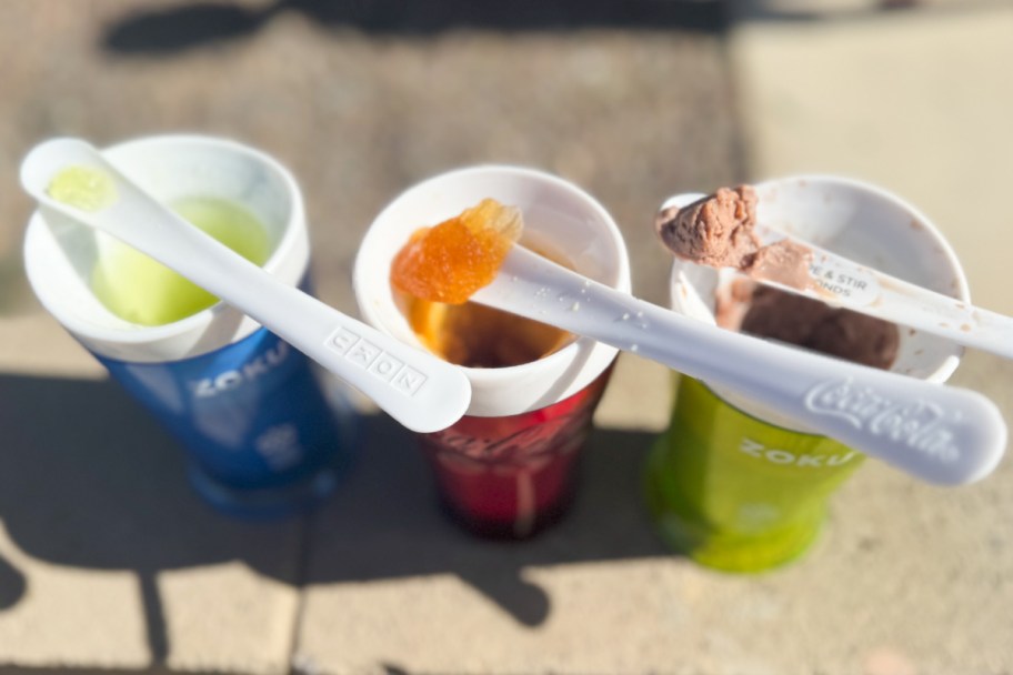 spoons resting on top of three slushie cups