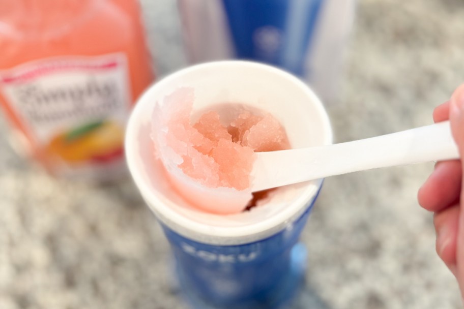 spoon scraping ice out of slushie cup